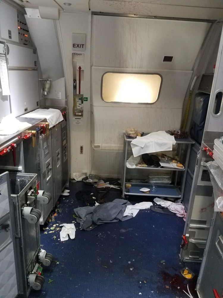 A galley shows the aftermath of a struggle between a passenger and flight attendants on a Delta jet traveling from Seattle to Beijing Thursday.
