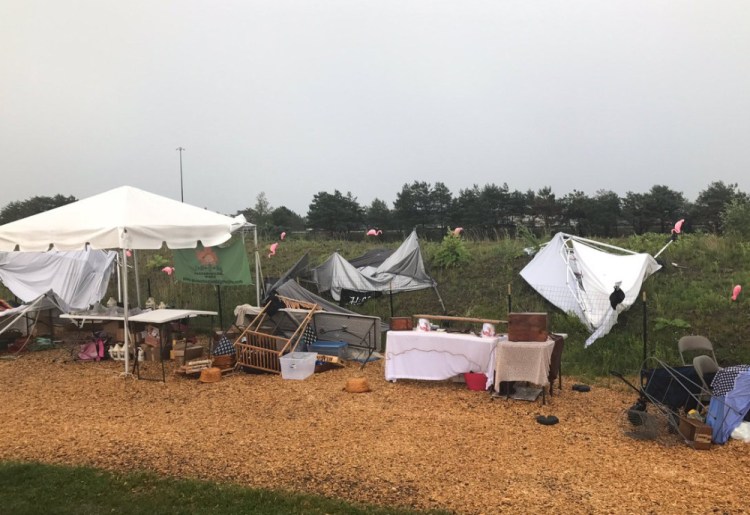 A fierce thunderstorm hit the Down East lobster roll festival last summer at Thompson's Point in Portland.
