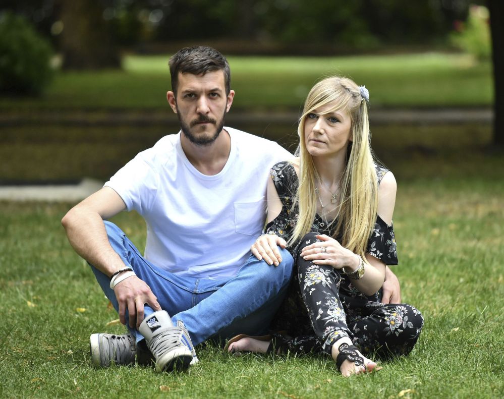 Parents of Charlie Gard, Connie Yates and Chris Gard, pose ahead of delivering a petition with more than 350,000 signatures to the hospital in London on Sunday.
Dominic Lipinski/PA via AP