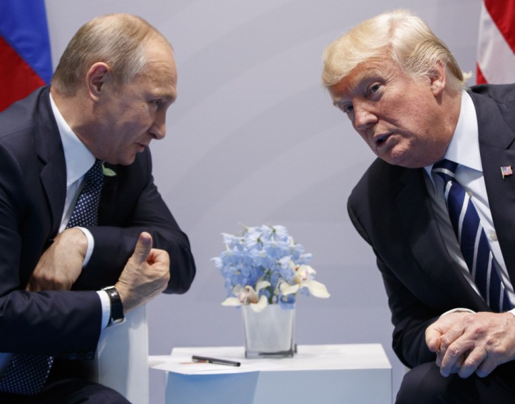 At their July 2017 meeting at the G20 conference in Hamburg, President Trump says he "strongly pressed" Russian President Vladimir Putin twice about meddling in the 2016 U.S. presidential election, but he didn't say whether he believed Putin's denial.