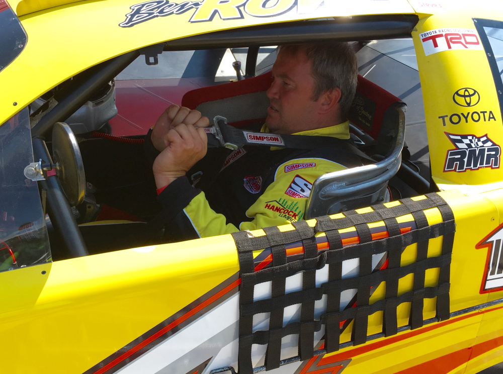 Four-time Pro All Stars Series champion Ben Rowe, of Turner, buckles into his car during a practice session for the Oxford 250 last summer at Oxford Plains Speedway.