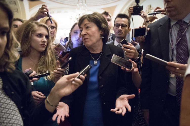 Sen. Susan Collins, R-Maine, is surrounded by reporters on Capitol Hill on Thursday after a revised version of the Republican health care bill was announced by Senate Majority Leader Mitch McConnell.