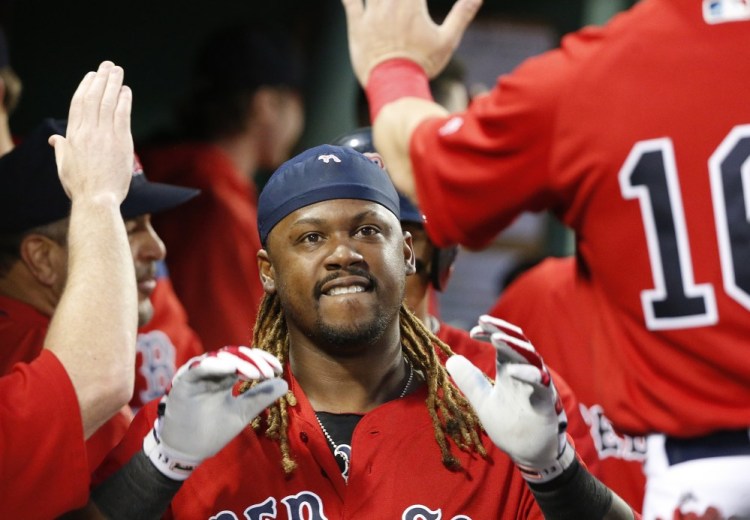 Boston's Hanley Ramirez celebrates his two-run home run in the third inning Friday night against the New York Yankees at Fenway Park.
