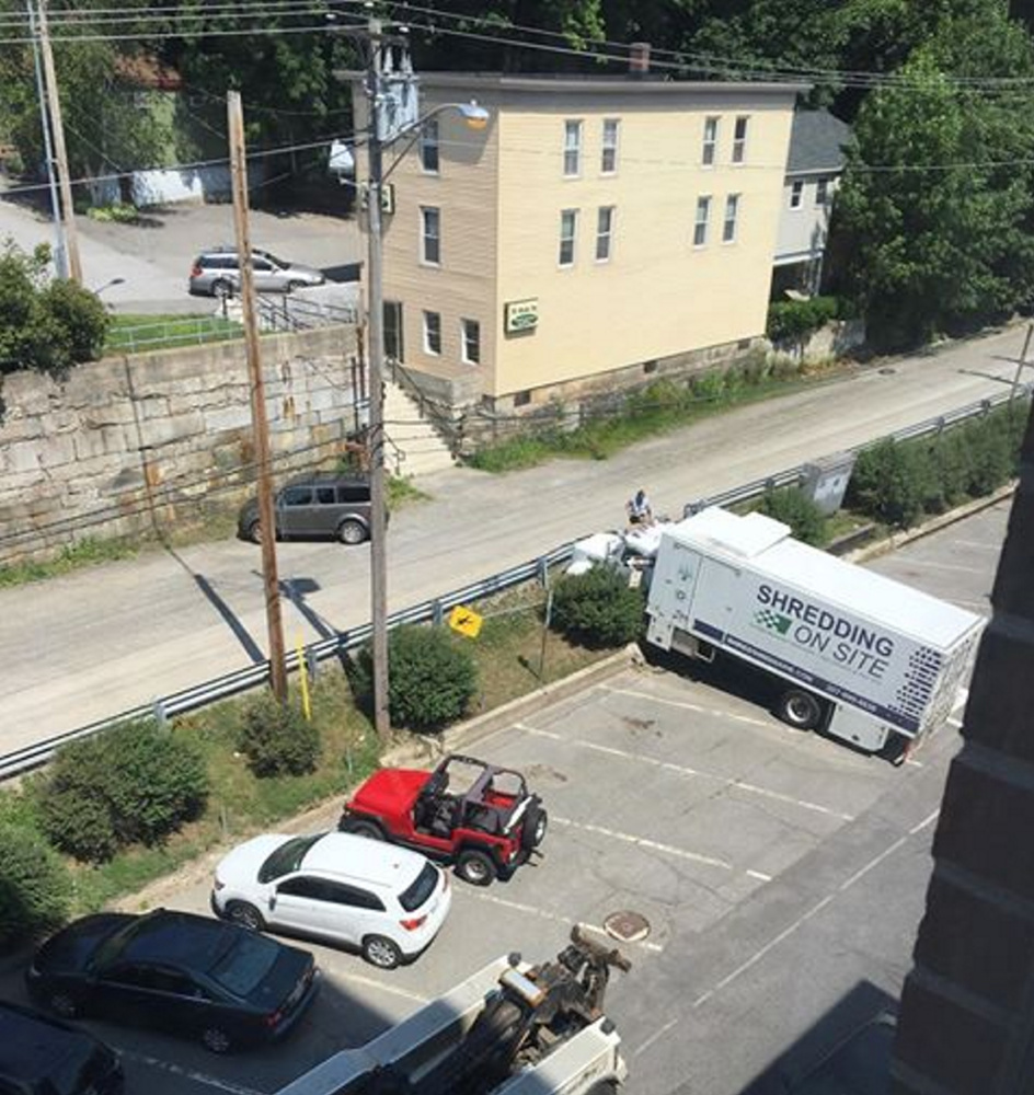 A Shredding On Site truck rolled across the street and into a concrete wall Monday morning in Augusta.