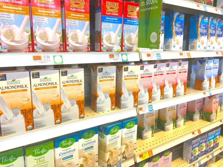 The word "milk" appears on many plant-based beverages at the Portland Whole Foods Market.
