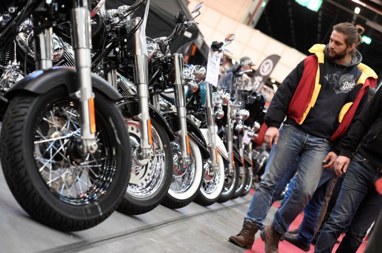Harley-Davidson bikes are shown at a bike fair in Hamburg, Germany, in February. The company is cutting jobs as young Americans buy fewer bikes than baby boomers did.