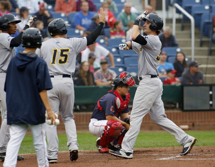 Trenton's Zach Zehner celebrates with teammates after hitting a home run in the second inning off Portland starting pitcher Jake Drehoff on Tuesday at Hadlock Field. The Thunder scores seven times in the inning and held on for a 9-6 win.