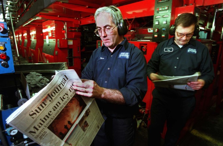 As this photo from the 1998 ice storm indicates, the Portland Press Herald and the Sun Journal in Lewiston have long helped each other out under dire circumstances. Here, one-time assistant foreman Steve Brown, left, and press operator Ray Maxwell Jr. look over early copies of the Sun Journal that were being printed at the Portland paper's plant in South Portland. Power outages in Lewiston and much of central Maine had forced the publication to seek alternative printing sources.