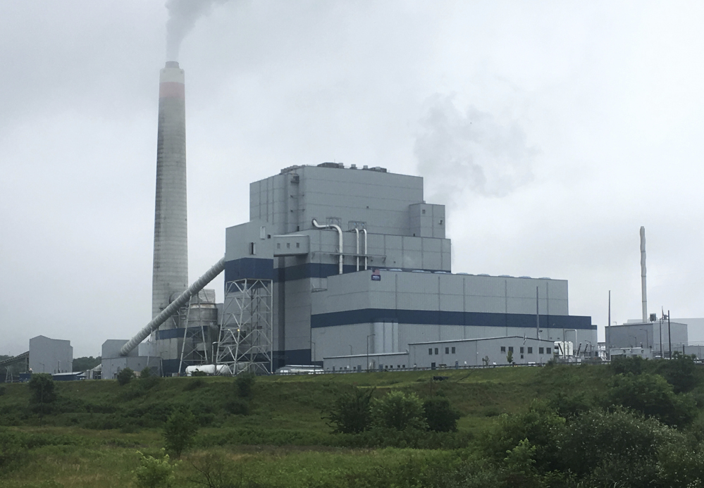 FILE - In this July 6, 2017, file photo, the Longview Power Plant in Maidsville, W.Va. The House voted July 18, 2017, to pass a Republican-backed bill delaying implementation of Obama-era reductions in smog-causing air pollutants. Congress voted 229 to 199 to approve the Ozone Standards Implementation Act of 2017. The measure delays by another eight years implementation of 2015 air pollution standards issued by the Environmental Protection Agency under the prior administration.(AP Photo/Michael Virtanen, File)