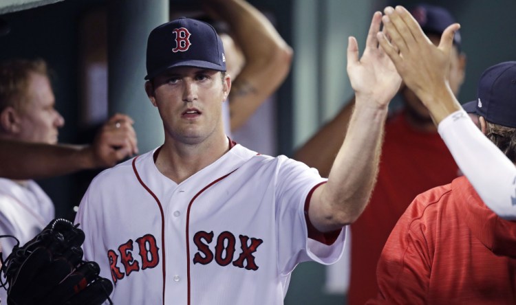 Red Sox starter Drew Pomeranz is congratulated in the dugout after being taken out of the game in the seventh inning Wednesday night at Fenway Park. Pomeranz pitched 6   innings and did not allow an earned run to win his 10th game.