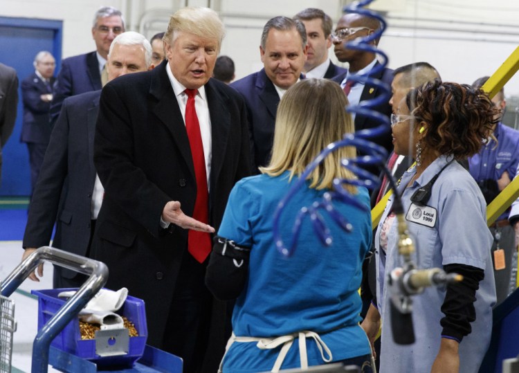 President-elect Donald Trump greets workers during a visit to the Carrier Corp. factory in Indianapolis on Dec. 1, 2016.