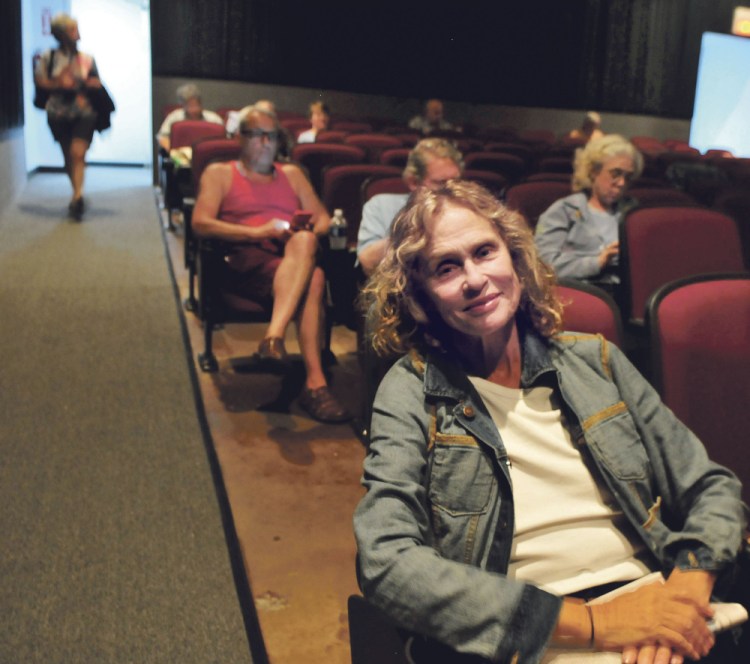 Lauren Hutton is seated in a Railroad Square Cinema theater in Waterville before "A Wedding" is shown Wednesday.