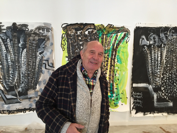 John Walker with some of his works being shown at the Bowdoin College Museum of Art in Brunswick.