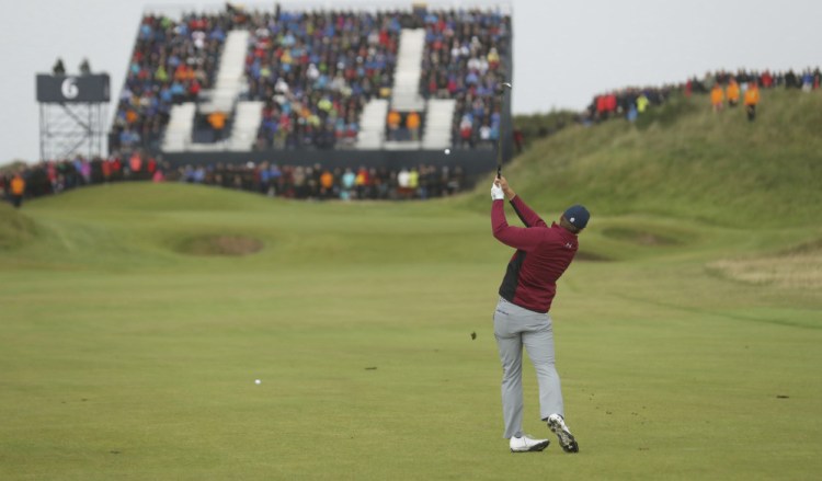 Jordan Spieth hits his approach shot on the sixth hole during the second round of the British Open. Spieth was one of only eight players who broke par Friday, as he followed his opening-round 65 with a 1-under 69.