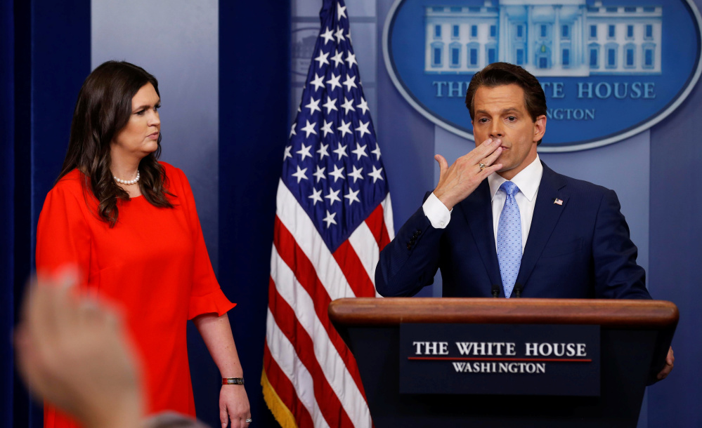 New White House communications director Anthony Scaramucci, blows a kiss to reporters while press secretary Sarah Huckabee Sanders looks on during the daily press briefing Friday.