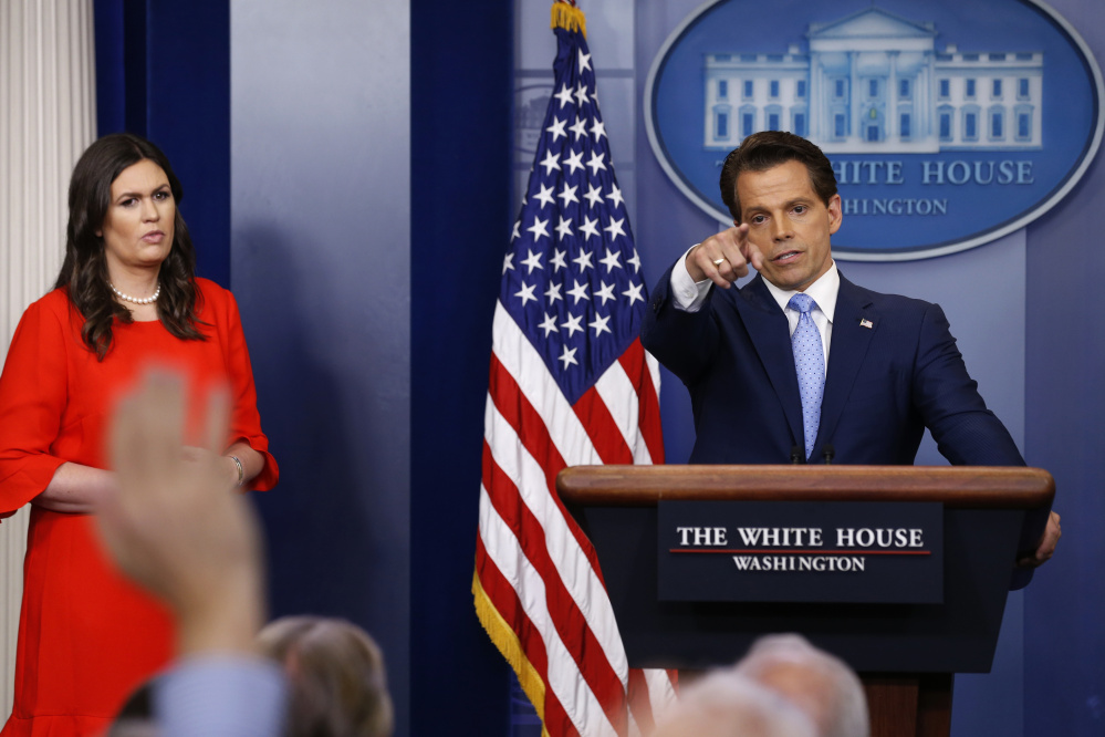 New White House Communications Director Anthony Scaramucci, flanked by White House Press Secretary Sarah Sanders, takes questions at the daily briefing at the White House in Washington, U.S. July 21, 2017. REUTERS/Jonathan Ernst - RTX3CG4J