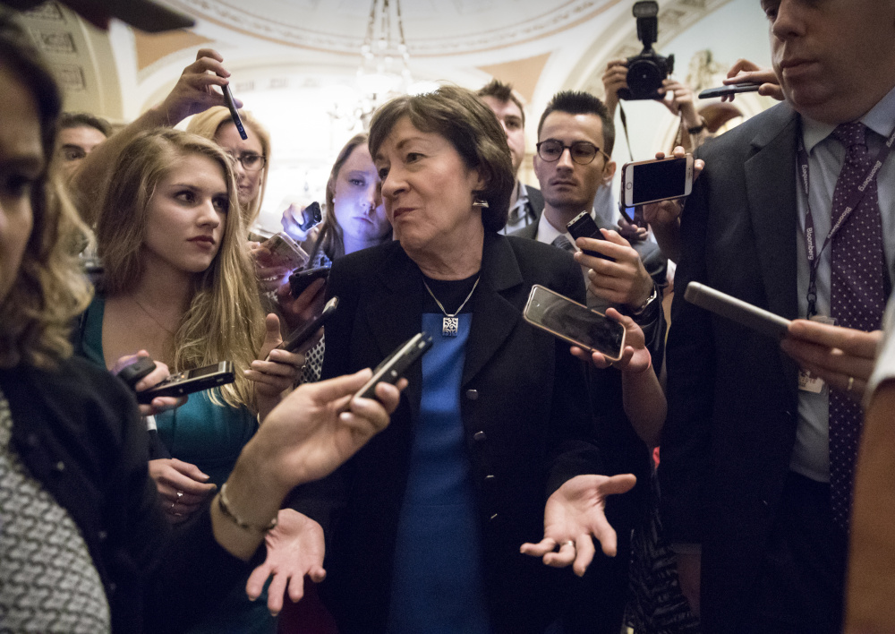 Sen. Susan Collins, R-Maine, is surrounded by reporters on Capitol Hill in Washington on July 13 after a revised version of the Republican health care bill was announced by Senate Majority Leader Mitch McConnell of Kentucky.