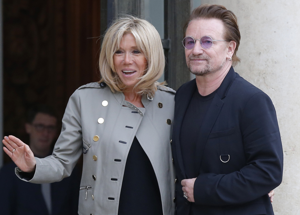 Brigitte Macron, the French first lady, and U2 singer and activist Bono pose at the Elysee Palace in Paris on Monday. The education of girls and women in Africa was discussed.