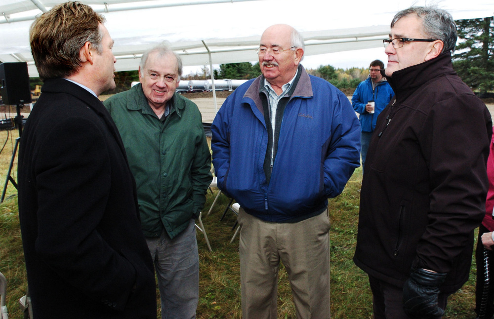 Attorney Dan Walker of Preti Flaherty, from left, speaks with Elery Keene and Ken Fletcher, both of Winslow, and Gary Bowman of Oakland before a groundbreaking ceremony for the Fiberight facility in Hampden on Oct. 26.