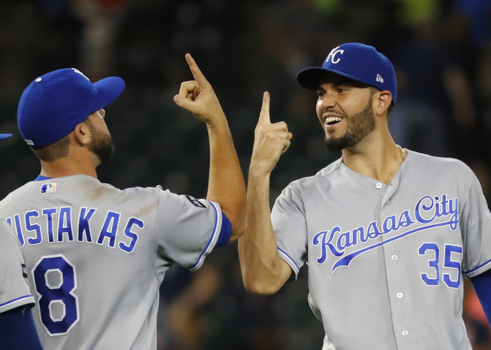 Kansas City's Mike Moustakas and Eric Hosmer celebrate after a 3-1 win Tuesday night in Detroit. The Royals extended their winning streak to seven.