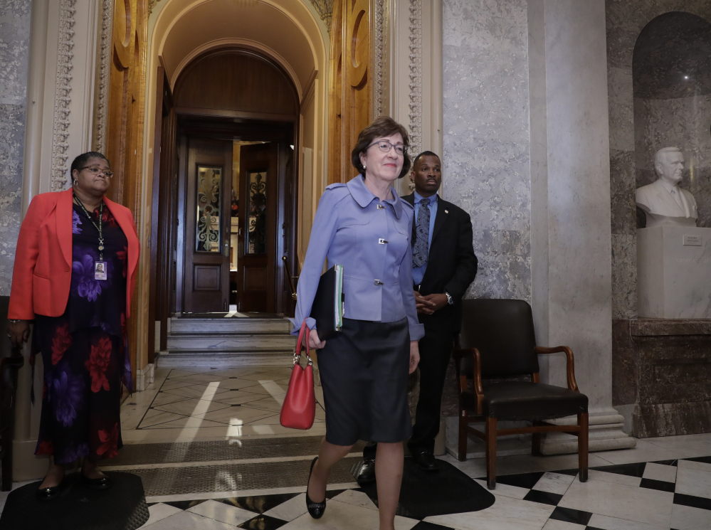 Sen. Susan Collins, R-Maine, leaves the chamber as the Republican-run Senate rejected a Republican proposal to scuttle President Obama's health care law and give Congress two years to devise a replacement, on Wednesday at the Capitol in Washington.