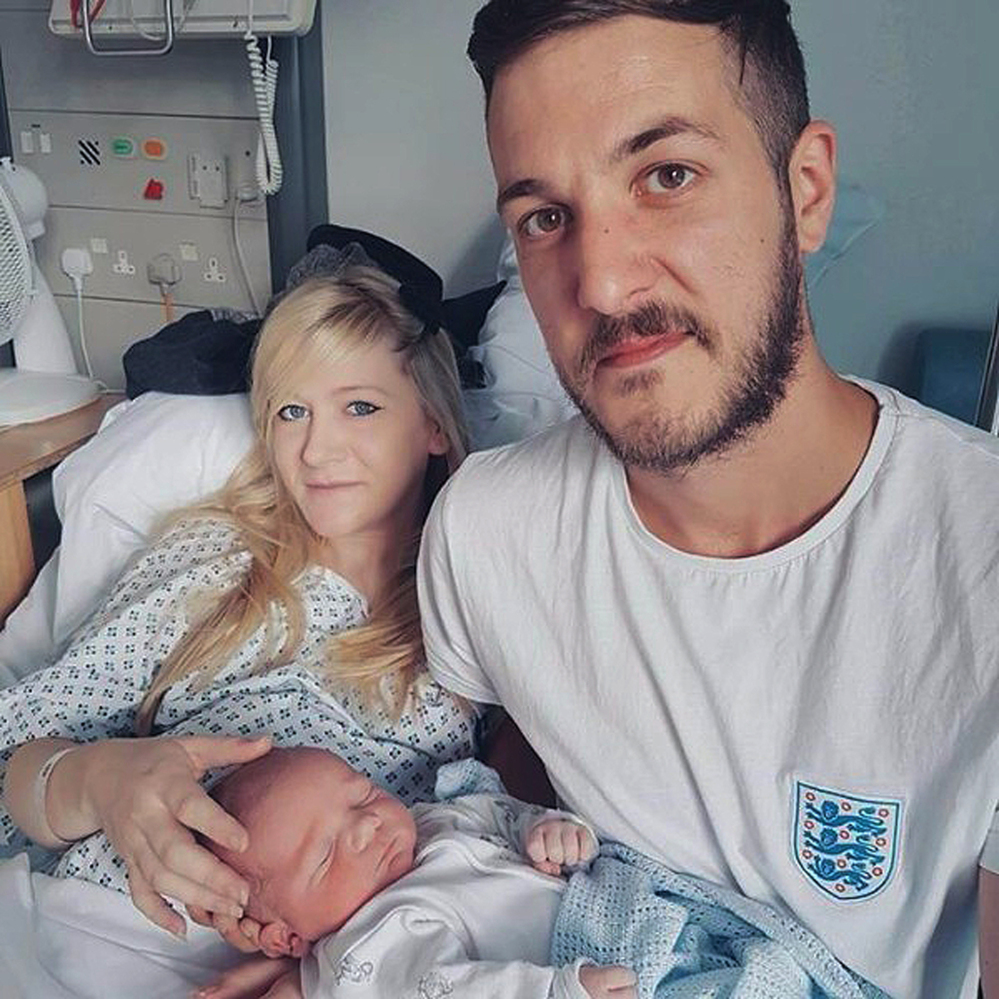 Chris Gard and Connie Yates hold their son, Charlie Gard, at Great Ormond Street Hospital in London.
