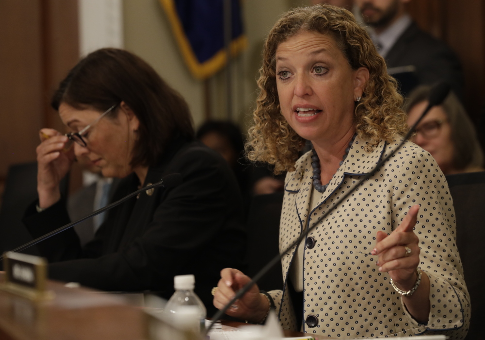 House Budget Committee member Rep. Debbie Wasserman Schultz, D-Fla., shown during a recent committee meeting next to Rep. Susan DelBene, D-Wash., says she delayed taking previous action against Imran Awan over concerns of due process and potential ethnic and religious profiling.
