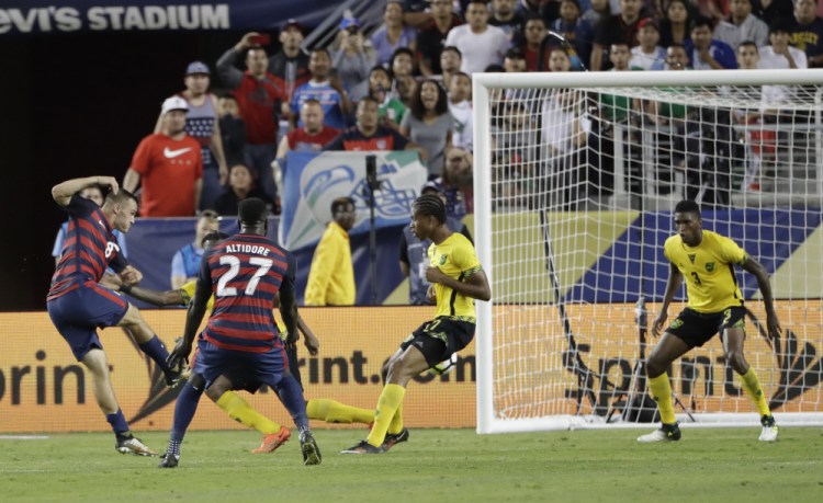 Jordan Morris of the United States scores his team's second goal against Jamaica during the second half of a 2-1 victory in the Gold Cup championship match late Wednesday night in Santa Clara, Calif.