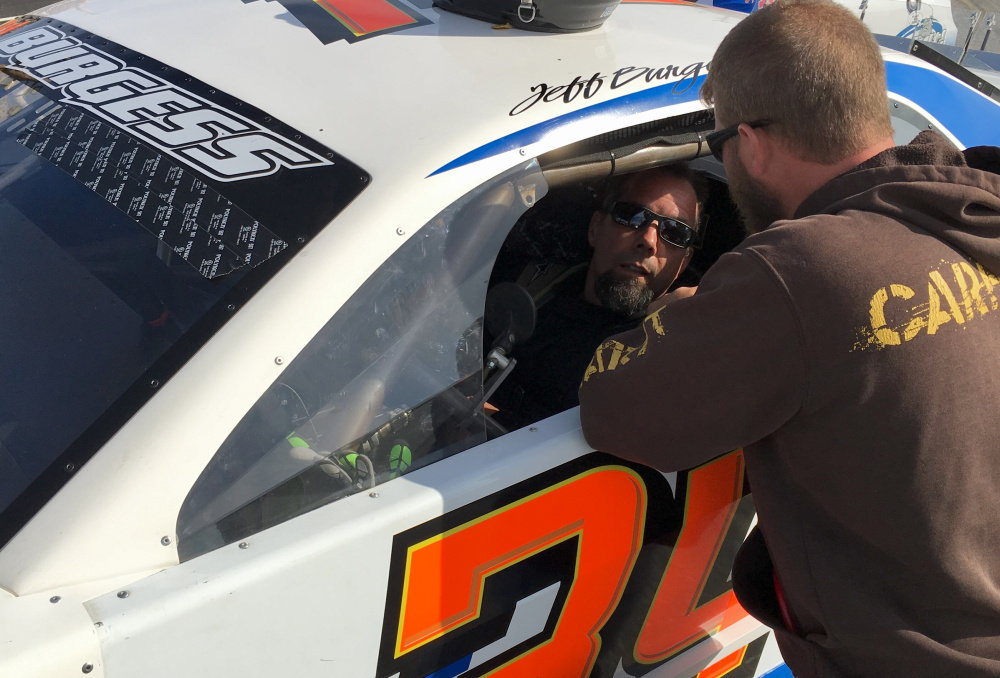 Jeff Burgess of East Madison gets buckled into his car prior to the start of the Coastal 200 in May at Wiscasset Speedway. The two-time Unity Raceway champion is seeking a signature win at Wiscasset in the Boss Hogg 150 on Sunday.