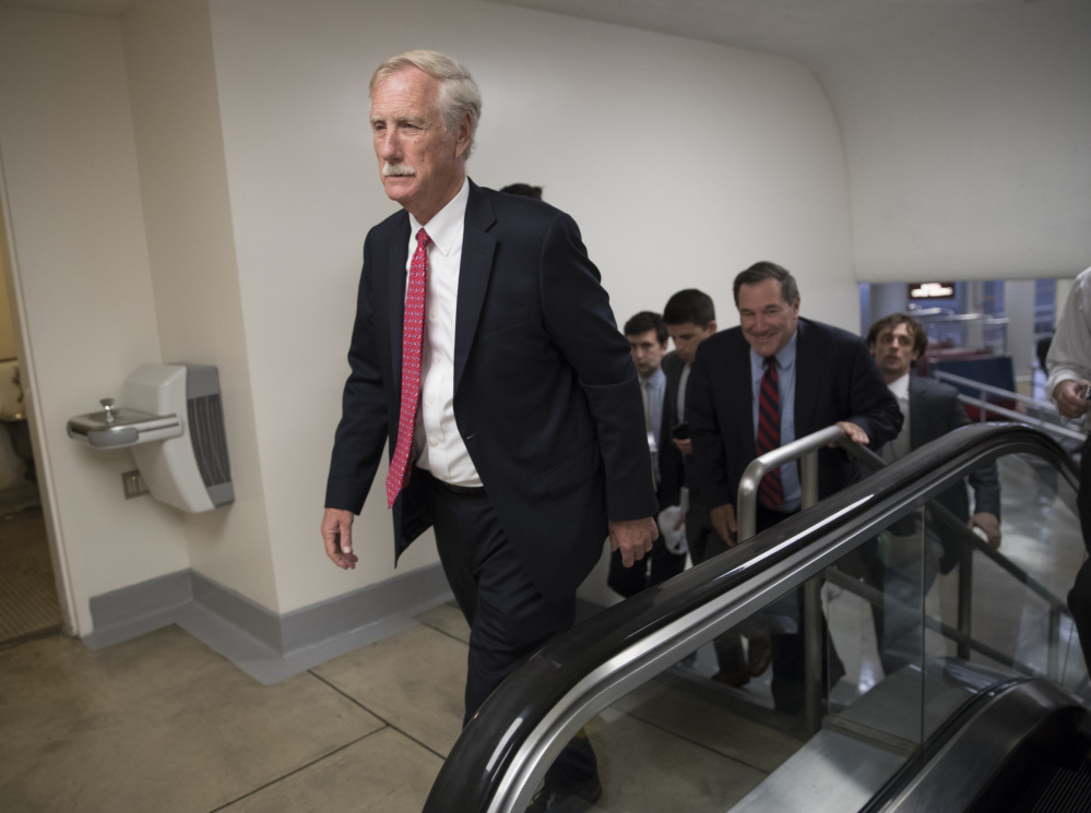Independent Maine Sen. Angus King heads to the Senate chamber on the day of the vote on the 'skinny' repeal.