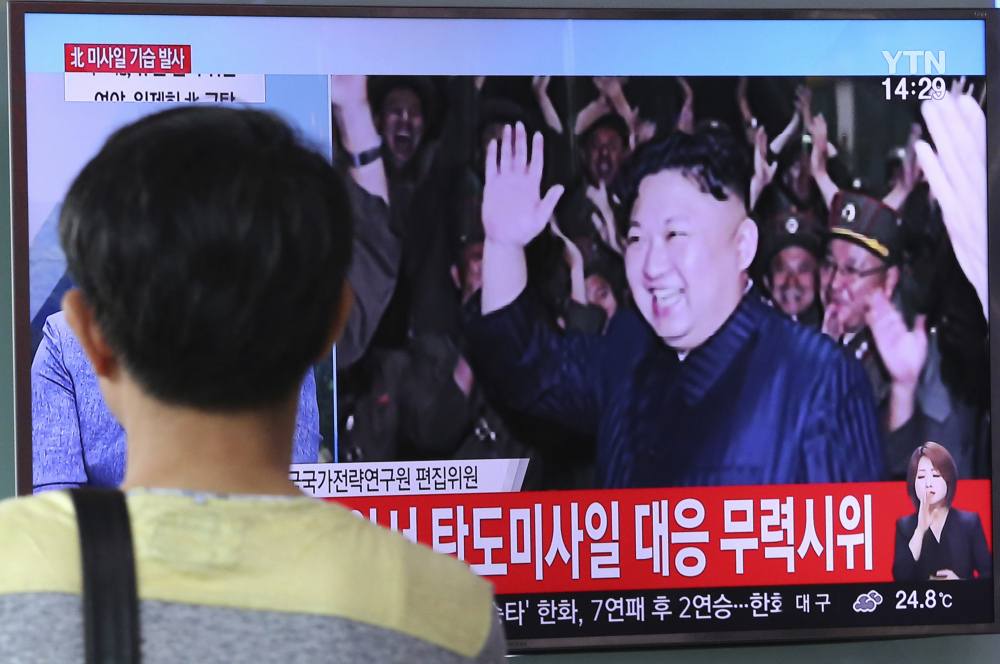 North Korean leader Kim Jong Un appears on TV in Seoul, South Korea, during the latest missile test launch.