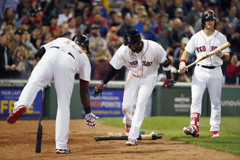 Red Sox newcomer Eduardo Nunez, center, celebrates with Hanley Ramirez after his second home run of the game Saturday night against the Kansas City Royals.
