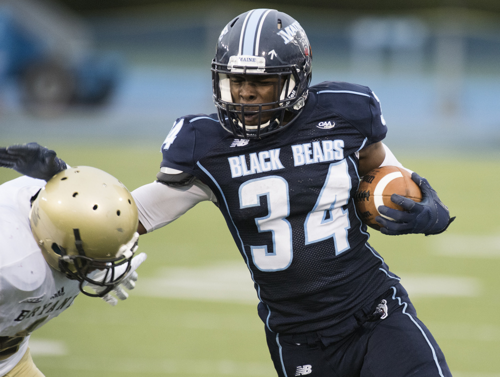 UMaine running back Josh Mack fends off a Bryant player in a game last season in Orono. Mack, now a sophomore, had a team-high 744 rushing yards and six touchdowns in 2016.