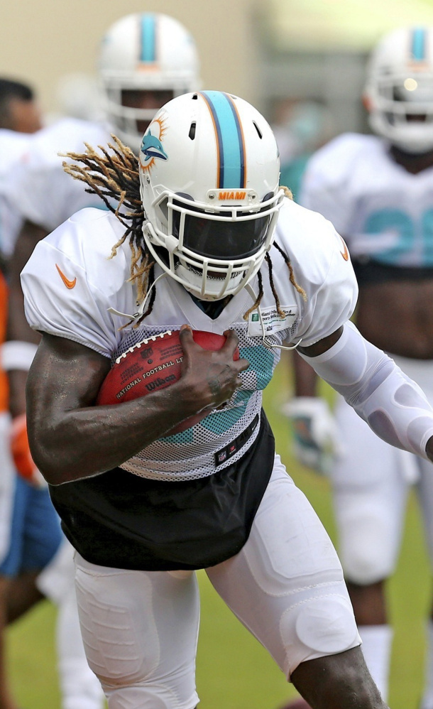 Miami running back Jay Ajayi, who rushed for 1,272 yards last season, left Monday's practice with a possible concussion.