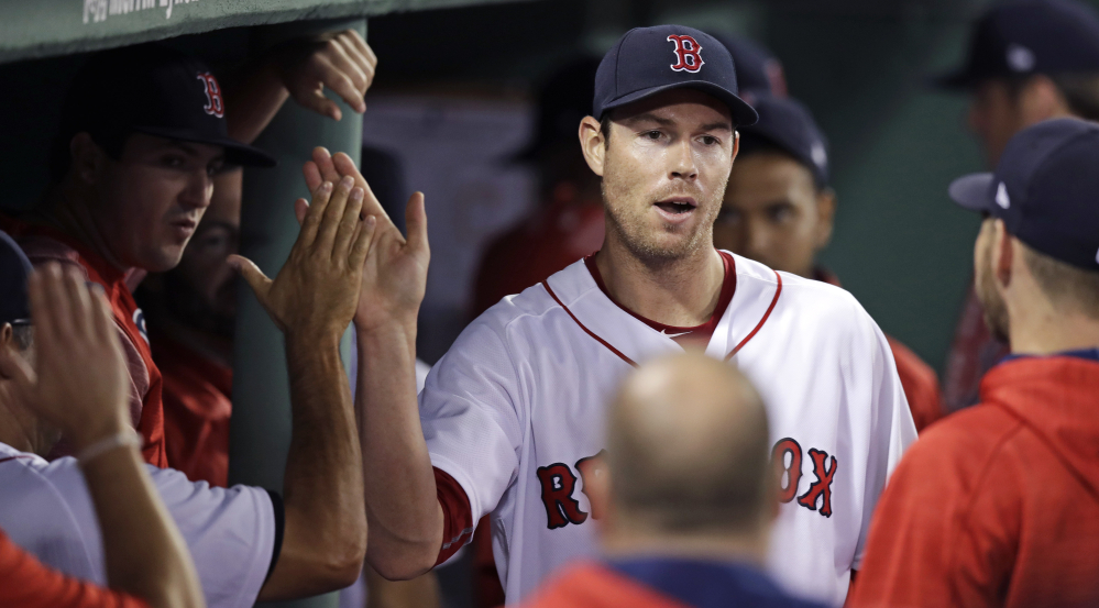 Red Sox starter Doug Fister is congratulated by teammates after being pulled in the eighth inning. Fister got his first win of the season, giving up just two runs on five hits.