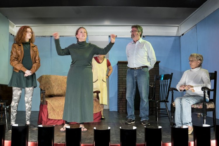 Allison Kuhns, center, waves her arms Monday while rehearsing her role as Miss Lettie Madden in the Vienna Historical Society annual play production of "Doctor's Orders."  She is joined on stage by Delaney Crocker, left, Chris Crocker, second from right and Karla Arceneaux, right.