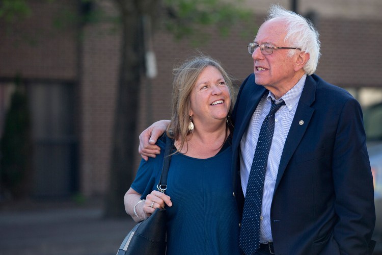 Sen. Bernie Sanders, I-Vt., and his wife, Jane, take a walk in State College, Pa. Federal prosecutors have stepped up a probe of a land deal made by Jane Sanders when she was head of a now-defunct Vermont college.