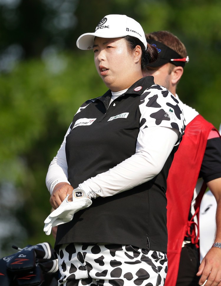 Shanshan Feng lines up her shot on the 13th tee during the first round of the U.S. Women's Open Golf tournament Thursday in Bedminster, N.J.