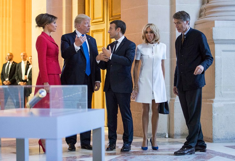 President Trump, Melania Trump, French President Emmanuel Macron and his wife Brigitte Macron tour Marechal Foch's Tomb with David Guillet, director of the Army Museum, at Les Invalides in Paris on Thursday.