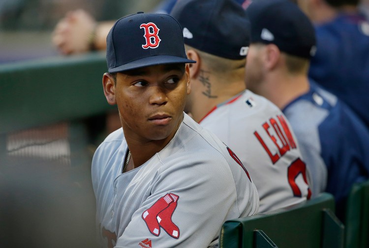 Boston Red Sox third baseman Rafael Devers sits in the dugout during the second inning of a baseball game against the Seattle Mariners Monday. Devers, a former Sea Dog player, was promoted from Pawtucket and is expected to start Tuesday.
