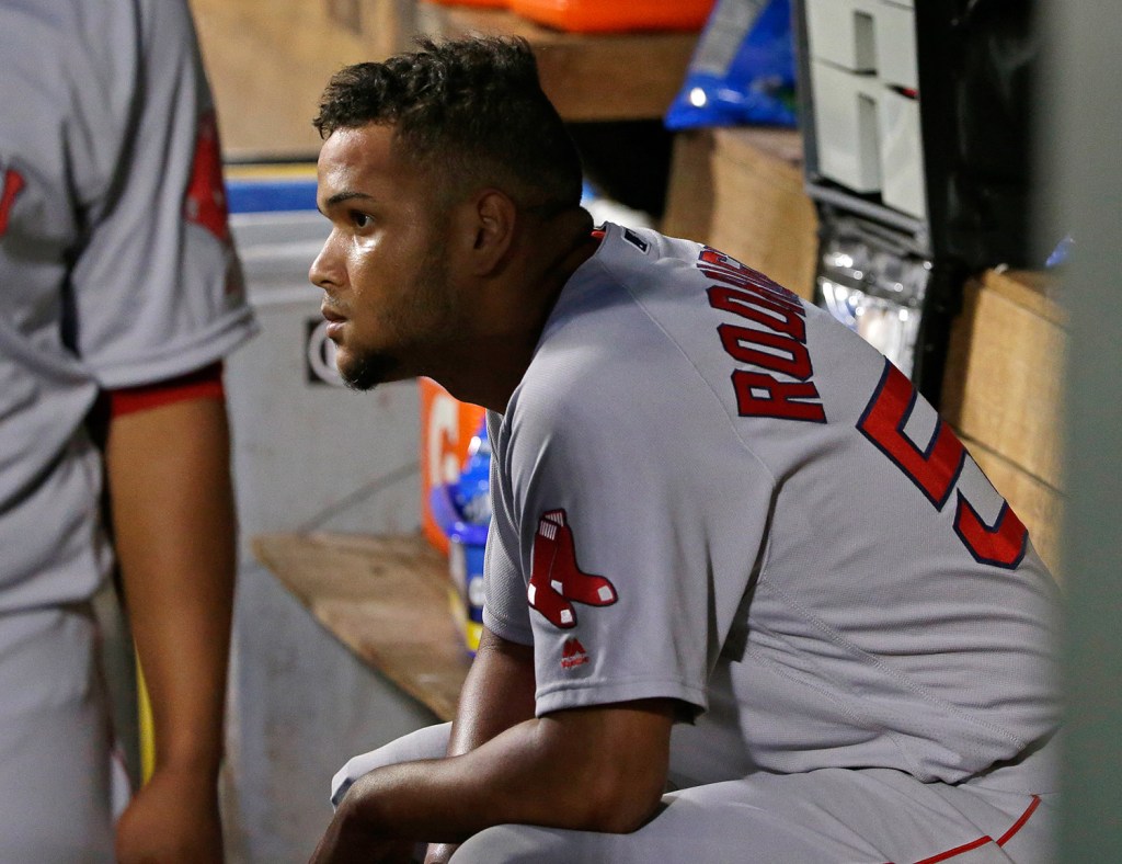 Boston starting pitcher Eduardo Rodriguez sits in the dugout after he was pulled in the sixth inning in Seattle. 