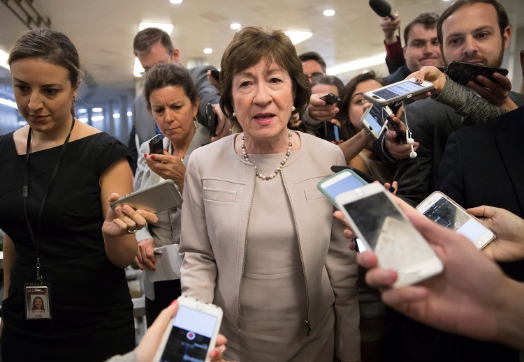 Sen. Susan Collins, R-Maine, is surrounded by reporters as she arrives on Capitol Hill in Washington before a test vote on the Republican health care bill. Collins was caught on a hot microphone Tuesday commenting on President Trump along with Democratic Sen. Jack Reed of Rhode Island.