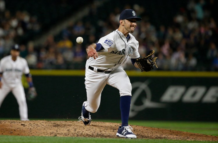 Steve Cishek was traded from Seattle to the Tampa Bay Rays on Friday for versatile right-hander Erasmo Ramirez.
