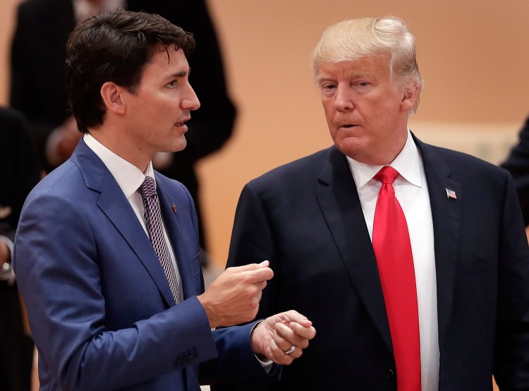 Canada's Prime Minister Justin Trudeau talks to President Trump in Germany in August. 
