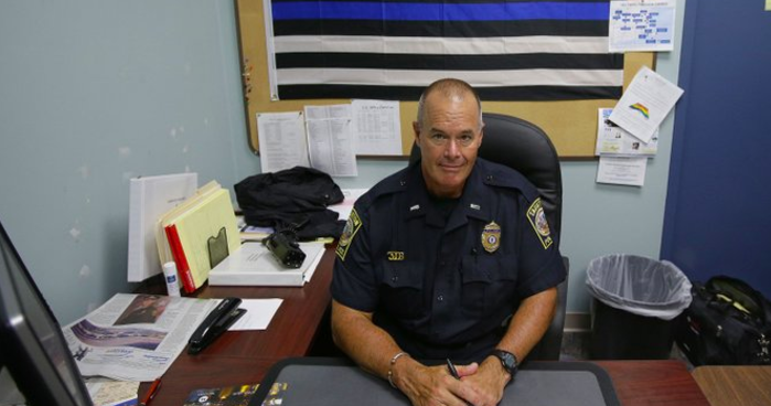 Taunton, Mass., police Lt. Paul Roderick sits behind his desk at police headquarters. Police departments are increasingly using Facebook to inform the community about what they’re doing and who they’re arresting. Some add a little humor to the mix. Civil rights advocates complain that posting mugshots and written, pejorative descriptions of suspects amounts to public shaming. Roderick recently wrote and posted an account of the arrest of Amy Rebello-McCarthy.  Stephan Savoia/Associated Press

