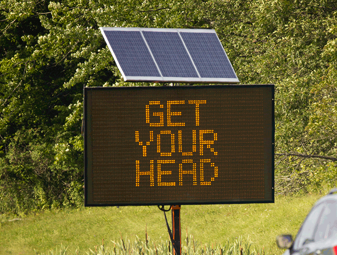 Motorists drive past a humorous Maine Department of Transportation safety message on the northbound lanes of I-295 near the Portland-Falmouth border on Friday, June 28, 2017.