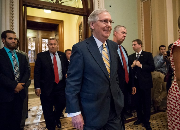 Senate Majority Leader Mitch McConnell of Ky. leaves the Senate chamber on Thursday, after announcing the revised version of the Republican health care bill. 