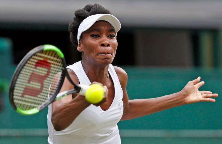Venus Williams returns a volley to Croatia's Ana Konjuh during their women's singles match at Wimbledon Monday.