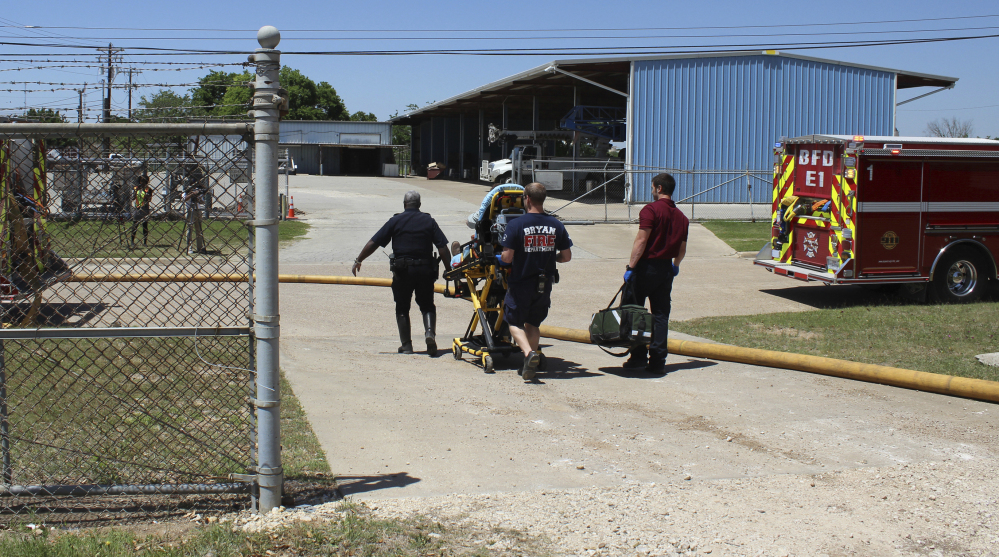 Firefighters transport a victim to an ambulance after an explosion at the Bryan Texas Utilities Power Plant that killed Earle Robinson, 60, and injured two other employees in 2014. That year, the fatality rate among older workers in Texas was 6.1 per 100,000 workers – 43 percent higher than the accident rate for all workers.