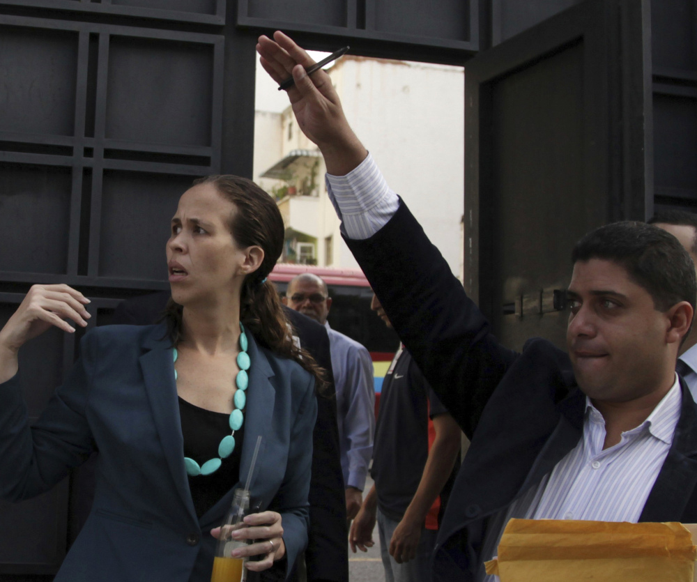 Opposition lawmaker Manuela Bolivar, left, at the Venezuelan General Prosecutor's office Thursday to push for an investigation into the recent elections.